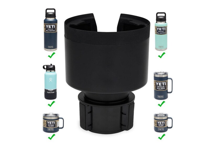 May include: A black car cup holder with a base and a top that can be adjusted to fit different sizes of cups and bottles. The holder is shown with a blue Yeti Rambler bottle, a blue Yeti Rambler mug, a light blue Hydro Flask bottle, and a green Yeti Rambler bottle.