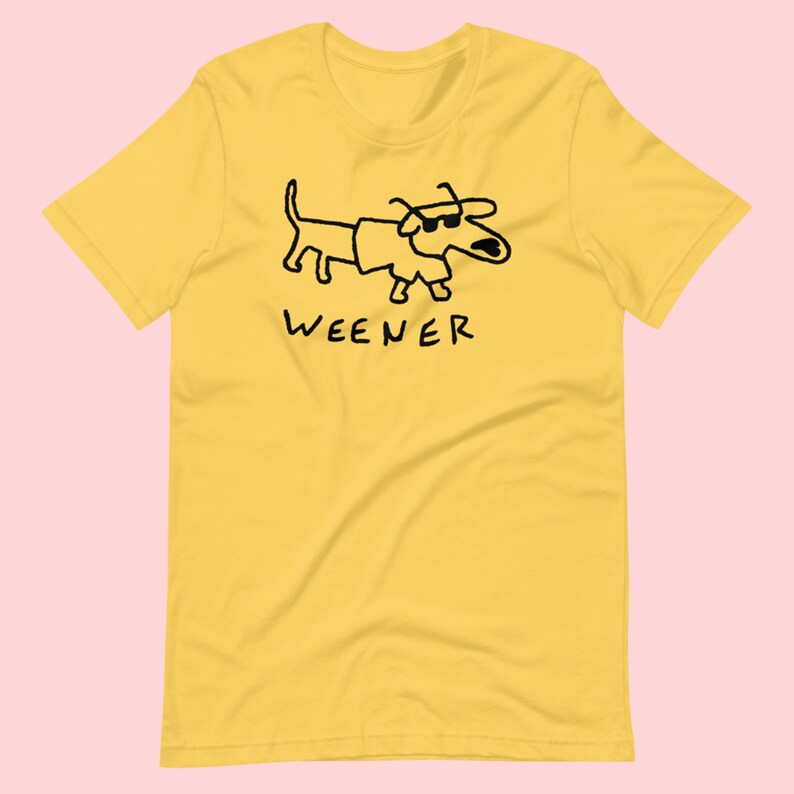 May include: Yellow short-sleeved t-shirt with a black cartoon dachshund wearing sunglasses and the word "WEENER" printed below.