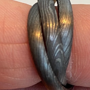 New. Custom made Damascus 'Trinity' ring - three slim Damascus bands combined as one - four steels, fused together as one