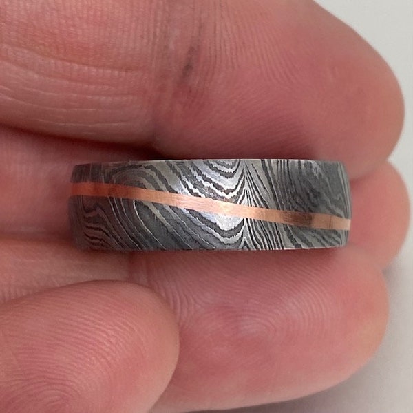 Custom made Damascus steel 8mm Wedding Band - four steels, with a single diagonal rose gold copper band