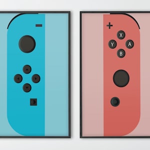 May include: Two framed prints of a stylised Nintendo Switch Joy-Con controller. The left print features a blue controller with black buttons and the right print features a red controller with black buttons.