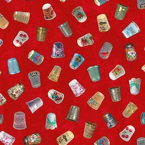 May include: A red background with a variety of colorful thimbles with different patterns and designs. The thimbles are made of metal and have a variety of shapes and sizes.