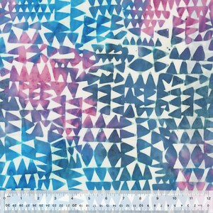 May include: A white fabric with a blue and pink geometric pattern of triangles. The fabric has a subtle watercolor effect.