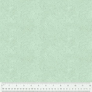 May include: A light green fabric with a subtle pattern of tiny white dots. The fabric has a smooth texture and a slightly textured surface.
