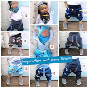 May include: A collage of six images showcasing different styles of baby pants with a blue and gray color scheme. The pants feature a unique design with a drop crotch and pockets. The fabric has a playful print of dinosaurs and stars. The text "Inspiration mit dem Stoff" is visible in the center of the collage.