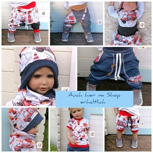 May include: A collage of photos showing a baby wearing different clothing items with a fire truck theme. The clothing includes a hat, scarf, shirt, shorts, and pants. The text "Auch hier im Shop erh&auml;ltlich" is visible in the image.