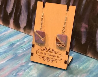 Earrings: "Not all marks are unsightly"