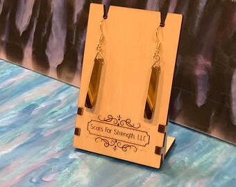 Earrings: "GET CATTY." (meow)