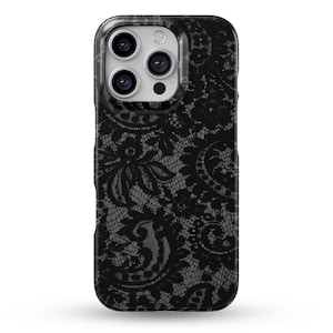 May include: A black smartphone case featuring a detailed, intricate lace pattern in shades of black and dark grey. The design covers the entire back of the case, which has a rectangular shape with rounded corners and a cutout for a triple camera system.