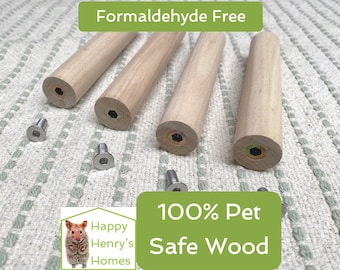 May include: Four wooden dowels with metal screws, labeled "Formaldehyde Free" and "100% Pet Safe Wood". The dowels are light brown and have a smooth finish. The screws are silver and have a hexagonal head.