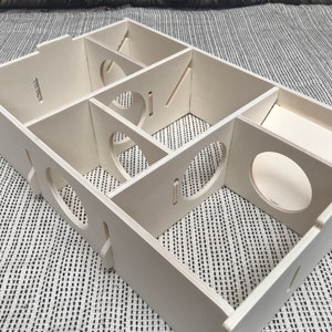 Large slot together multi chamber house for hamsters, made from formaldehyde free non toxic poplar plywood. Has 6 internal chambers, which are configurable to suit the quantity and sizes required. Shown with lid removed and ramp at rear right.
