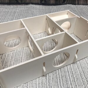Large slot together multi chamber house for hamsters, made from formaldehyde free non toxic poplar plywood. Has 6 internal chambers, which are configurable to suit the quantity and sizes required. Shown with lid removed and ramp at rear right.