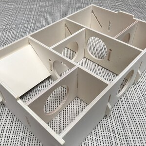 Large slot together multi chamber house for hamsters, made from formaldehyde free non toxic poplar plywood. Has 6 internal chambers, which are configurable to suit the quantity and sizes required. Shown with lid removed and ramp at rear left and small dividers repositioned.
