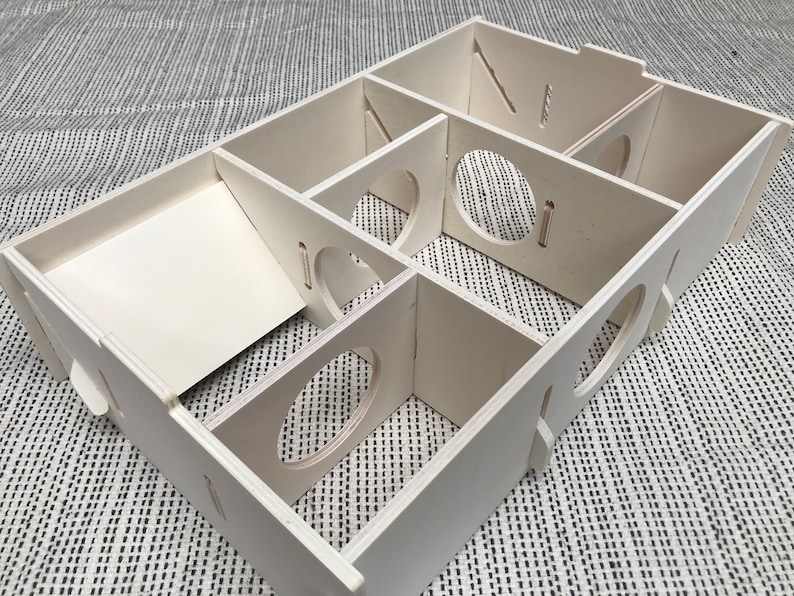 Large slot together multi chamber house for hamsters, made from formaldehyde free non toxic poplar plywood. Has 6 internal chambers, which are configurable to suit the quantity and sizes required. Shown with lid removed and ramp at rear left and small dividers repositioned.