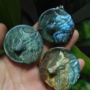 carve gemstone. labradorite wolf. carved wolf head. wolf necklace. carve gemstone. carve crystal wolf. craft wolf charm. wolf carving