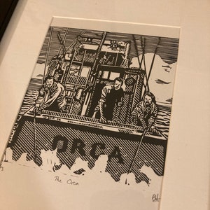 The Orca: Hand carved and hand printed picture of the three man crew in a scene from Spielberg’s 1975 Classic Jaws.