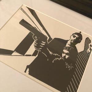Leon: The professional, a hand carved and hand printed portrait of Natalie Portman and Jean Reno in the 1994 Luc Besson film.