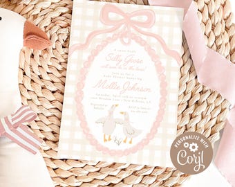 May include: A baby shower invitation with a pink and beige gingham pattern. The invitation features the text "Silly Goose" and "Mollie Johnson" in a script font, along with two cartoon geese. The invitation is surrounded by a pink pearl-like oval frame.