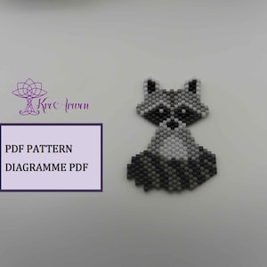 May include: A black and white beaded raccoon pattern, with the text "PDF PATTERN DIAGRAMME PDF" on a white background.