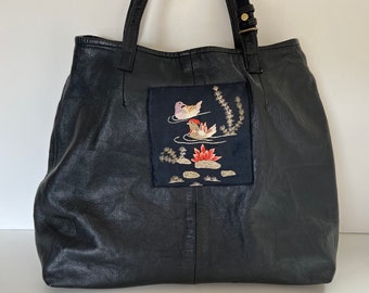 Black leather upcycled tote bag from vintage skirt