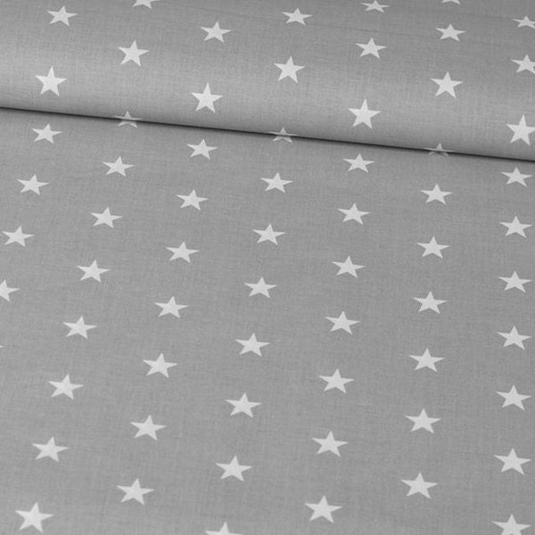 White stars on gray cotton fabric by the yard