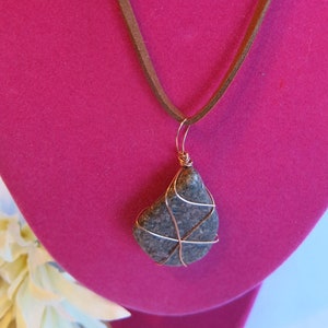 18&quot; brown leather string cord necklace with copper-wire-wrapped stone. Silver clasp. Unique colors & features in each stone.