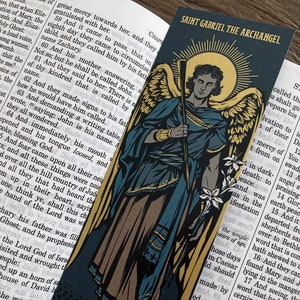 Saint Gabriel the Archangel illustrated by BARITUS Catholic Illustration, printed on bookmarks with metallic gold ink.