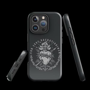 May include: Black phone case with a white design of a heart with thorns and the text "COR JESU SACRATISSIMUM MISERERE NOBIS".