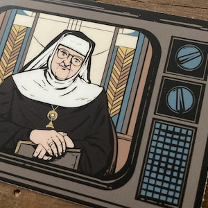 May include: A set of three ceramic mugs with a speckled, matte finish. The mugs are in shades of cream, light gray, and dark gray. Each mug has a simple, minimalist design and a rounded handle.