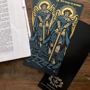 Saint Michael the Archangel illustrated by BARITUS Catholic Illustration, printed on bookmarks with metallic gold ink.