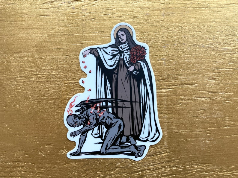 May include: A sticker featuring a religious illustration of a woman in a white robe and a black habit, holding a bouquet of red roses, standing over a kneeling figure with wings and flames. The woman is scattering red rose petals.