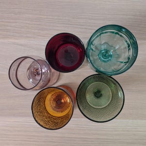 May include: A set of three ceramic mugs with a speckled, matte finish. The mugs are in shades of cream, light gray, and dark gray. Each mug has a simple, minimalist design, perfect for coffee or tea.