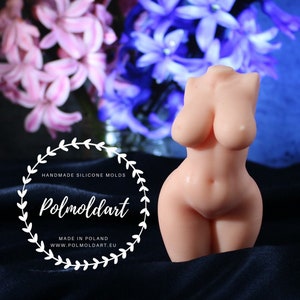May include: A light pink silicone torso mold with a feminine form. The mold is in front of a blurred background of pink and purple flowers. The text "HANDMADE SILICONE MOLDS" and "Polmoldart" is visible.