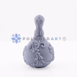 May include: A gray, ornate bottle with a faceted top and decorative floral and scrollwork details. The bottle has a bulbous shape and is likely made of resin or a similar material. The brand name "POLMOLDART®" is visible.