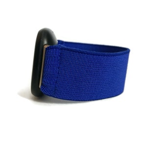 May include: A blue elastic watch strap with a black buckle.