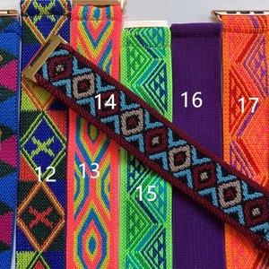 May include: A set of 10 colorful patterned watch bands with gold clasps. The bands are numbered 10 through 19.