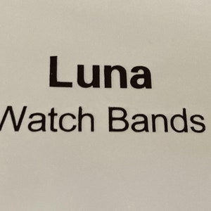 May include: A white label with black text that reads "Luna Watch Bands".