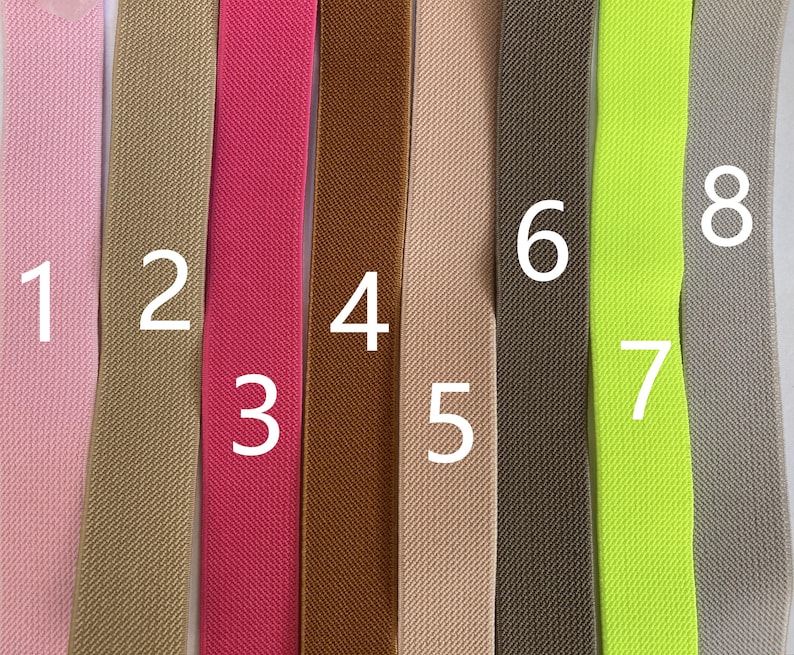 May include: Eight different colors of elastic fabric, numbered 1 through 8. The fabric is a woven, textured material.