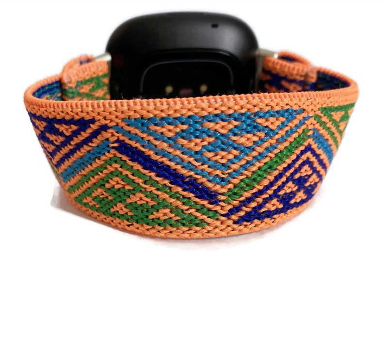 May include: Orange, green, and blue patterned woven elastic watch band.