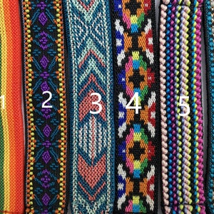 May include: Six vertical fabric bands featuring distinct woven patterns. Band 1 has rainbow stripes. Band 2 is black with purple and orange geometric shapes. Band 3 is teal with a chevron design. Band 4 has colorful geometric motifs. Band 5 is striped. Band 6 is teal with a diamond pattern. Each band is numbered 1 through 6.