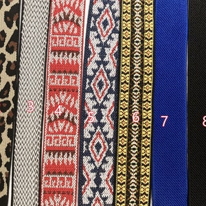 May include: Nine different types of elastic trim, each with a unique pattern. The trims are numbered 1 through 9. The trims are all about 1 inch wide.