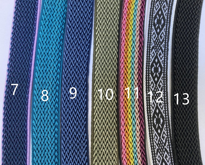 May include: Close-up of eight different types of woven trim, in various colors and patterns, including teal, navy, green, pink, and white. The trim is numbered 7 through 13.