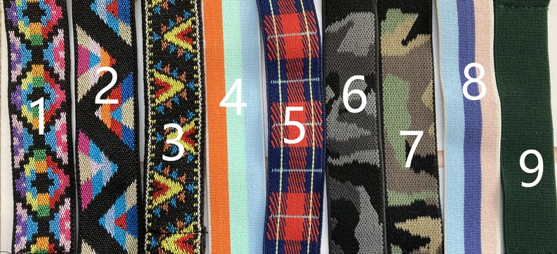 May include: Nine different types of colorful patterned ribbon, each with a number from 1 to 9. The ribbons are all about 1 inch wide and are made of different materials, including woven, knit, and printed.