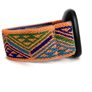 May include: A bright orange watch band with a geometric pattern in shades of blue and green. The band is made of woven fabric and has a black buckle.