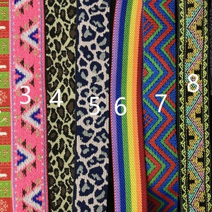 May include: A collection of ten colorful patterned ribbons. Designs include Christmas themes, chevron patterns, animal prints, rainbow stripes, and geometric shapes. The ribbons are suitable for various crafting projects.