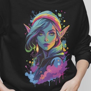 Op de afbeelding: Een kleurrijke illustratie van een vrouwelijke elf met blauw haar en puntige oren. De elf draagt ​​een kleurrijke hoed en een jas. De achtergrond is een zwart canvas met kleurrijke verfspatten.