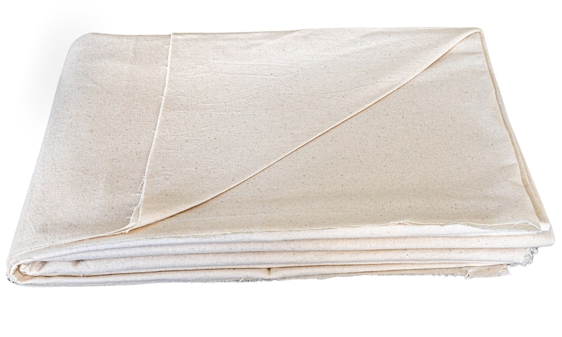 May include: A folded white cotton drop cloth, a versatile fabric used for protecting surfaces during painting or other messy projects.