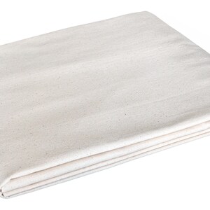 May include: A folded white cotton drop cloth, a versatile and durable fabric used for protecting surfaces during painting or other messy projects.