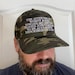 The attitudes of women and fish towards me are too varied and complex to be accurately described on a hat Cap, camouflage hat 