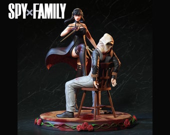May include: A woman in a black dress with a red cape holds a knife and stands over a man tied to a chair. The man is wearing a white hooded jacket and grey pants. The scene is set on a wooden platform with red roses and vines.